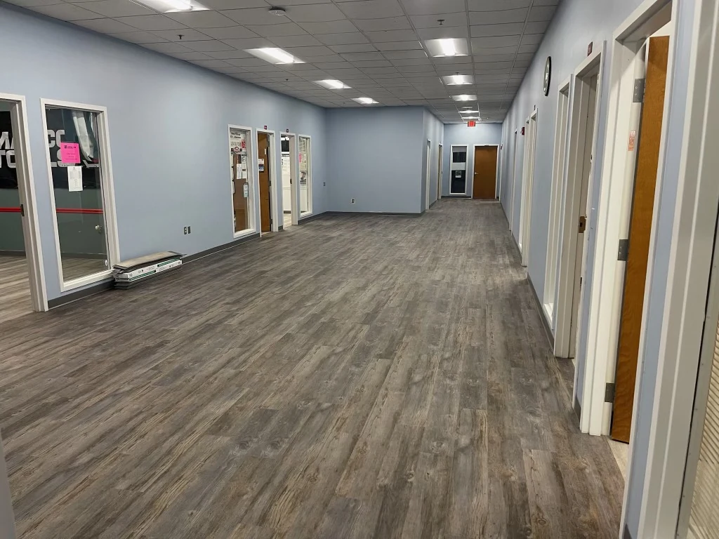 Wood-look LVP flooring installed in a Connecticut commercial hallway